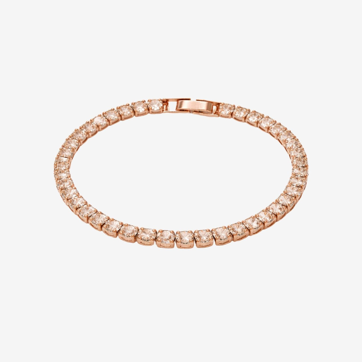Rose gold bracelet with diamonds on a light gray background