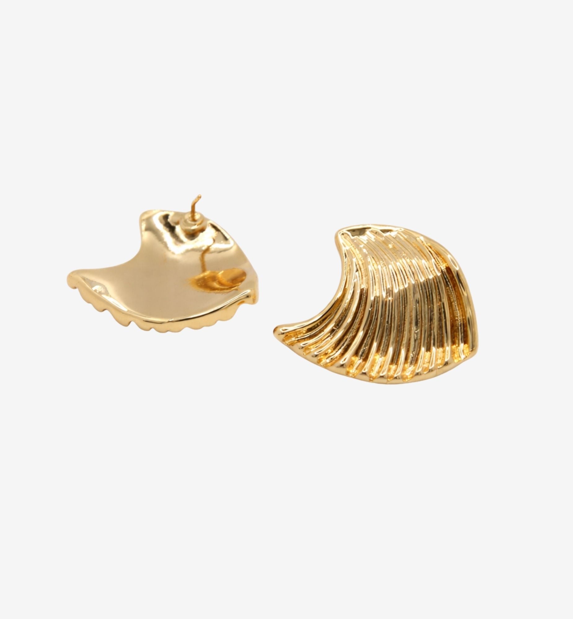 Gold shell-shaped earrings on a white background